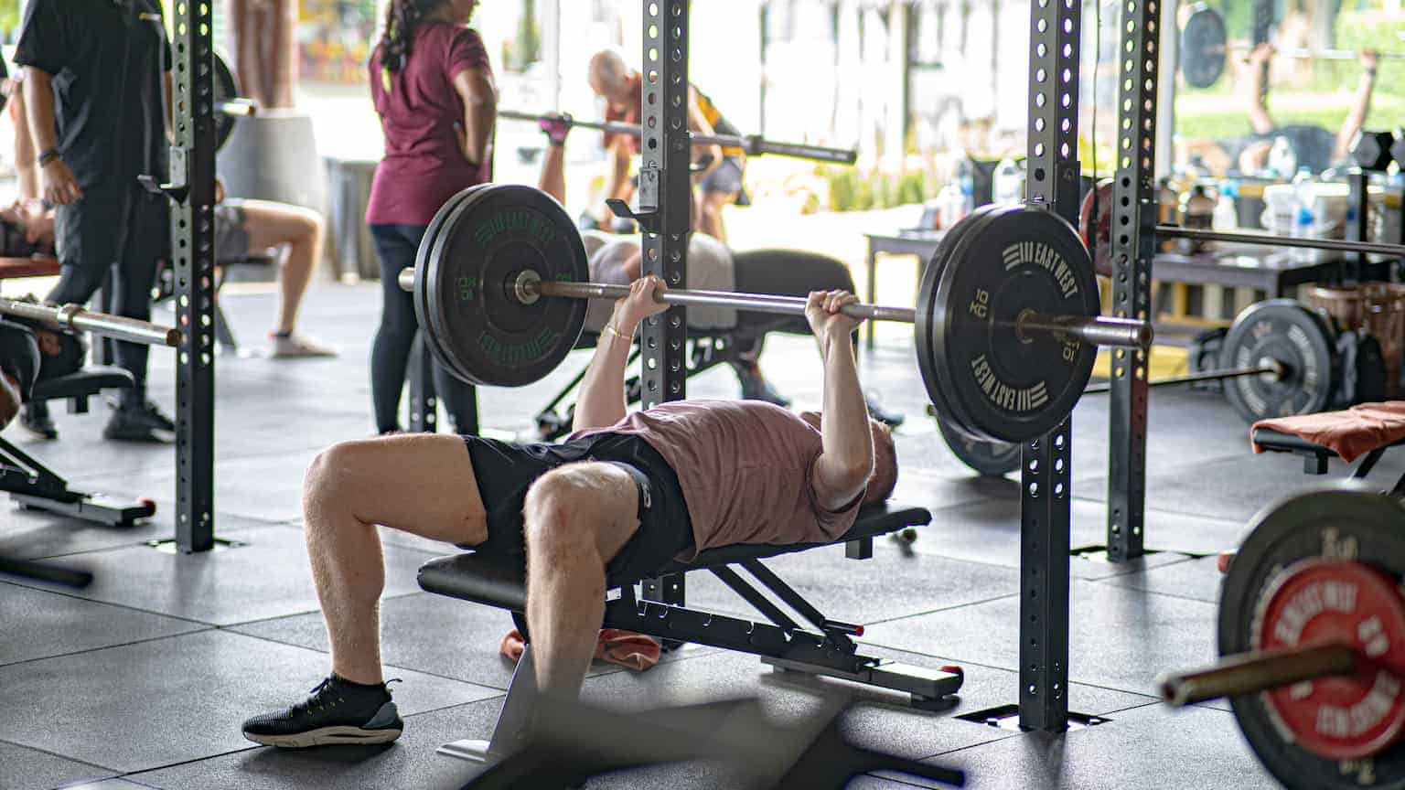 A man lifting weights in the gym