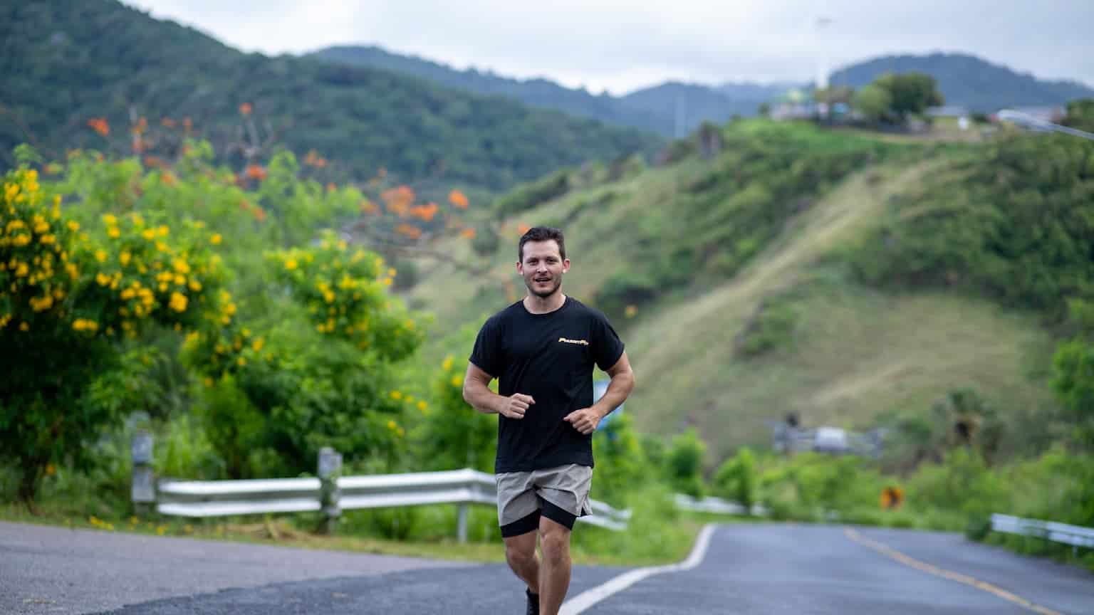 A man running up the hills of Promthep cape