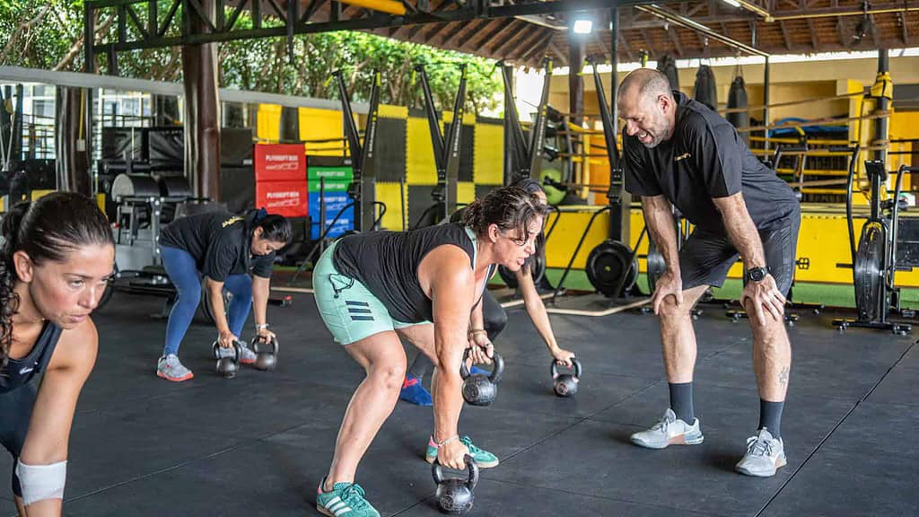 A group of people doing strength training exercises for weight loss