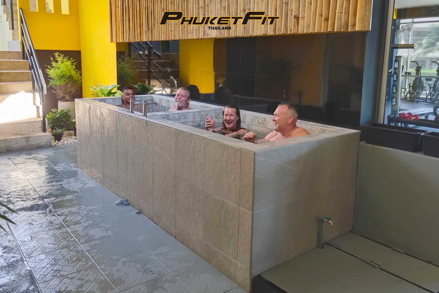 man and woman sit in an ice bath and practice mindfulness