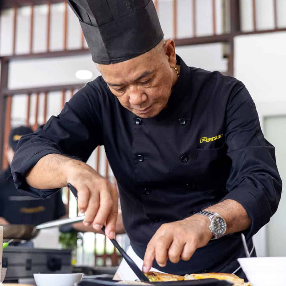 image of PhuketFit Chef Wara preparing a nutritional meal at thailand fitness retreat