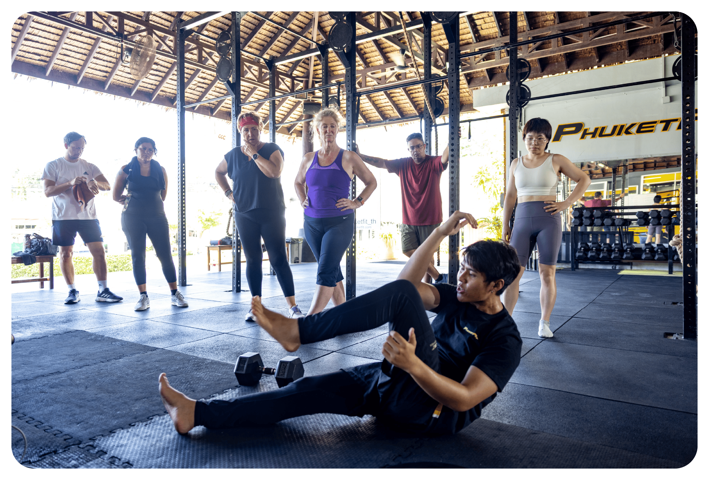photo of coach training phuketfit guests in open air gym