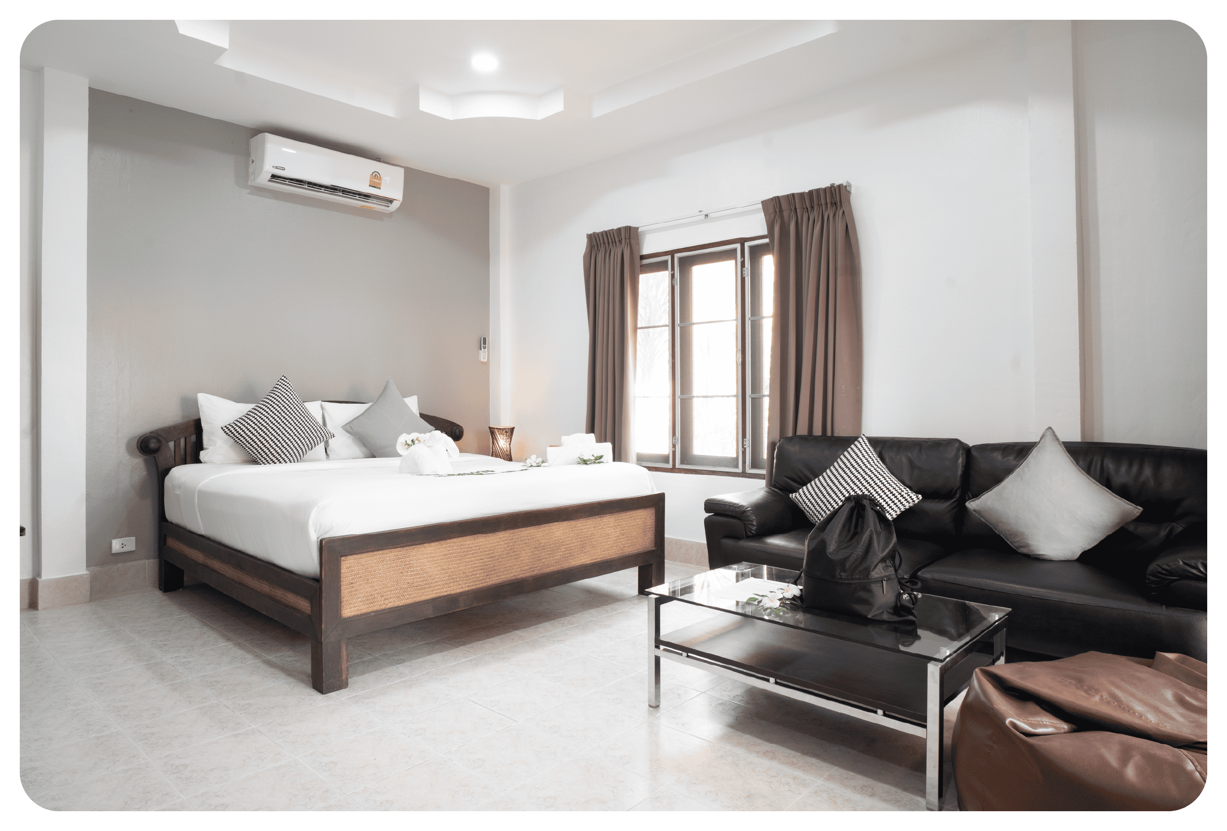 photo of double bed and amenities inside phuketfit superior villa accommodation