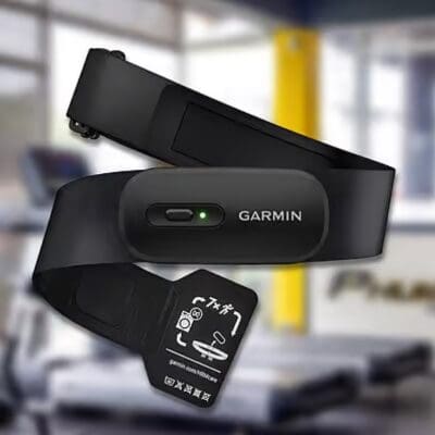 Man using heart rate training to monitor workout intensity at the gym